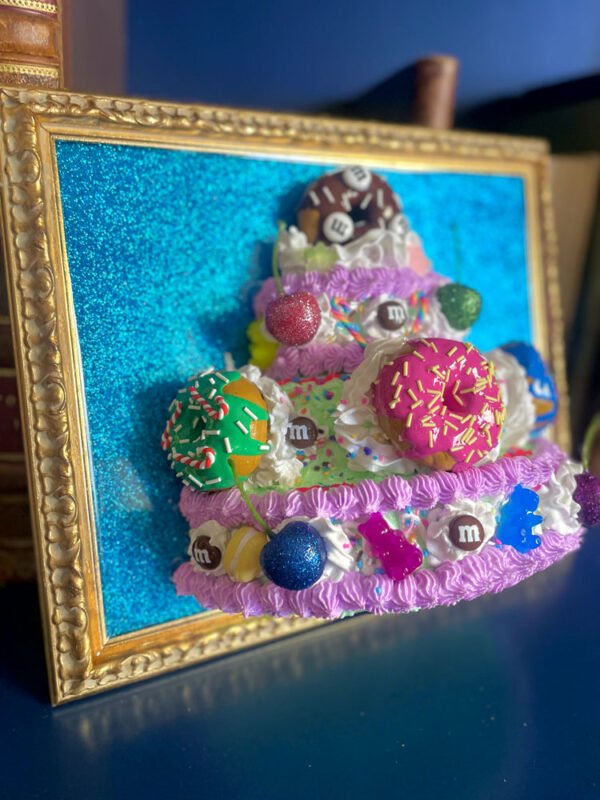 Quadro torta con ciambelle sfondo glitter blu 3